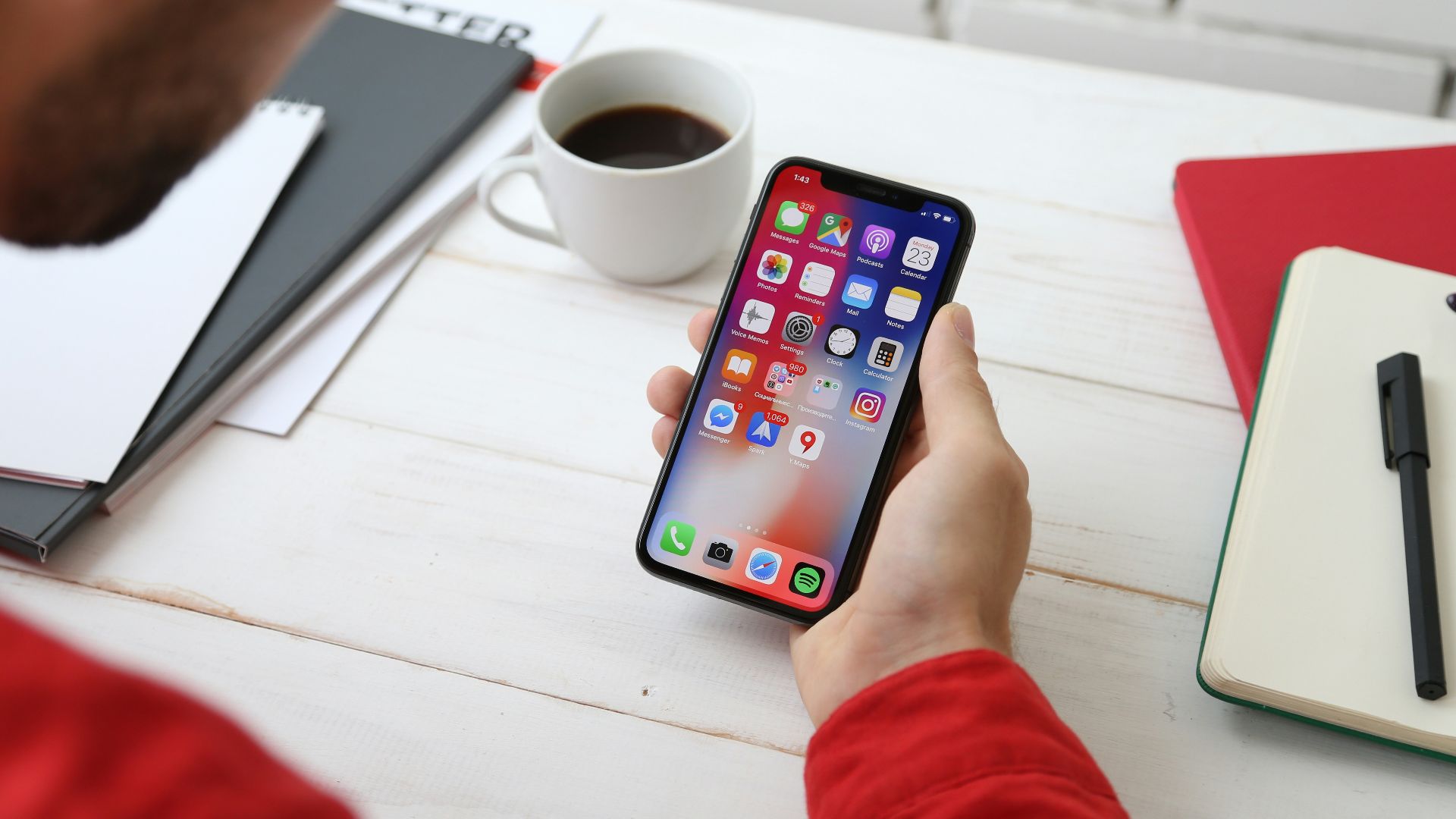 person holding space gray iPhone X