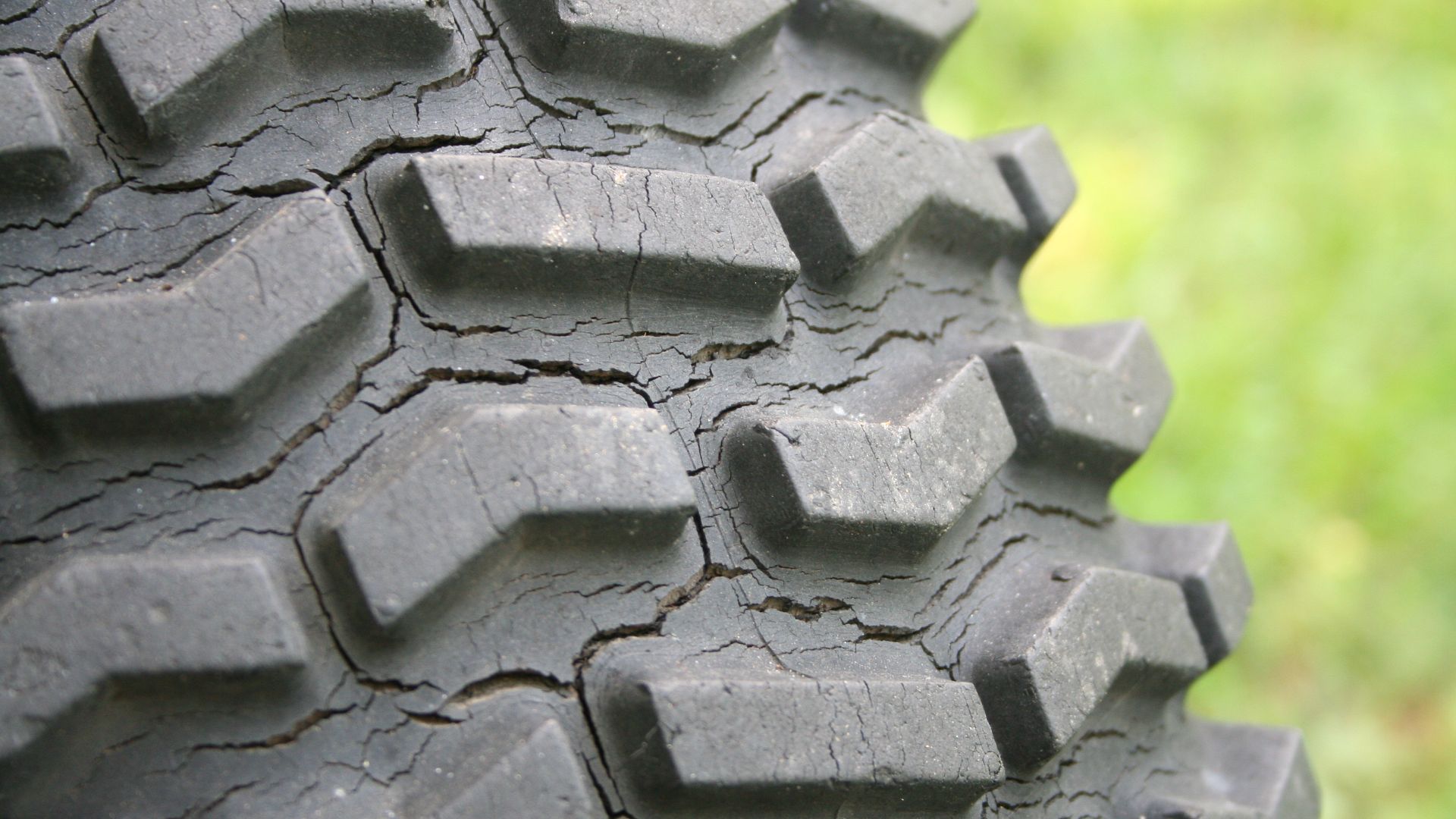 Tire showing weather-cracking over long-term exposure to the weather.