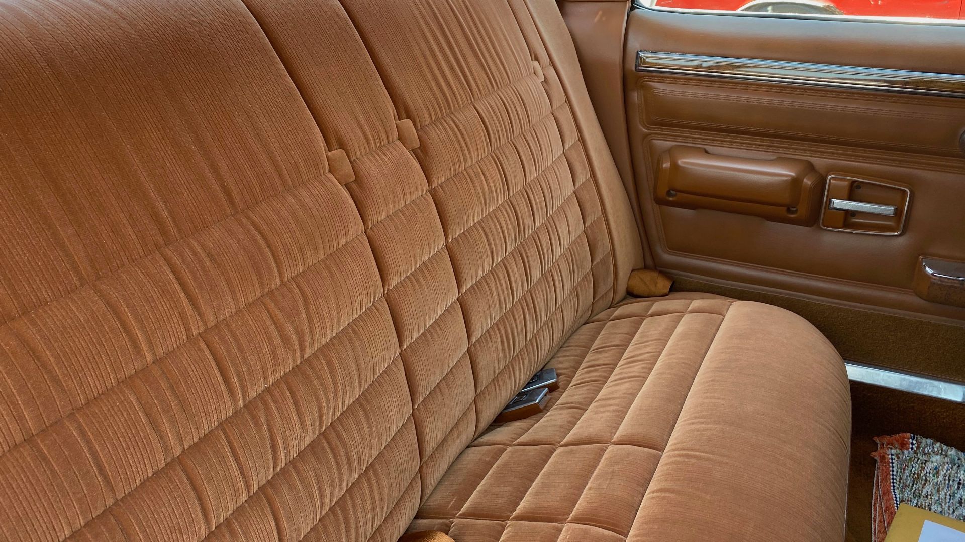 1981 AMC Concord DL four-door sedan, finished in Copper Brown with the standard full vinyl covered roof in beige. The matching interior is upholstered in