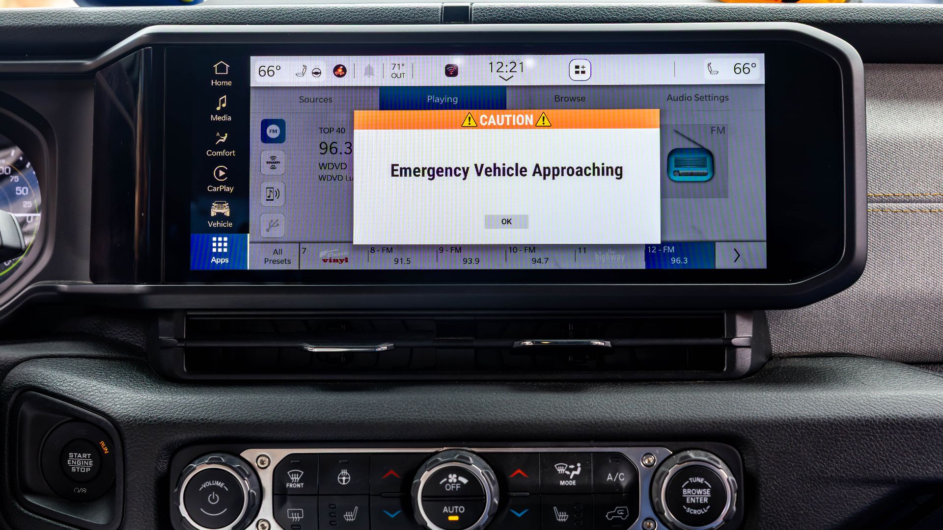 A HAAS Alert message from an approaching emergency vehicle is displayed on the infotainment screen of a Jeep Wrangler during a technology demonstration in Detroit in 2025
