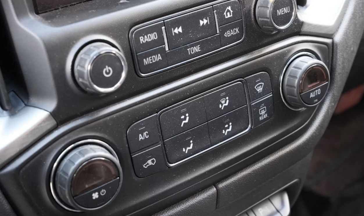 Car's dashboard showing controls for climate and media
