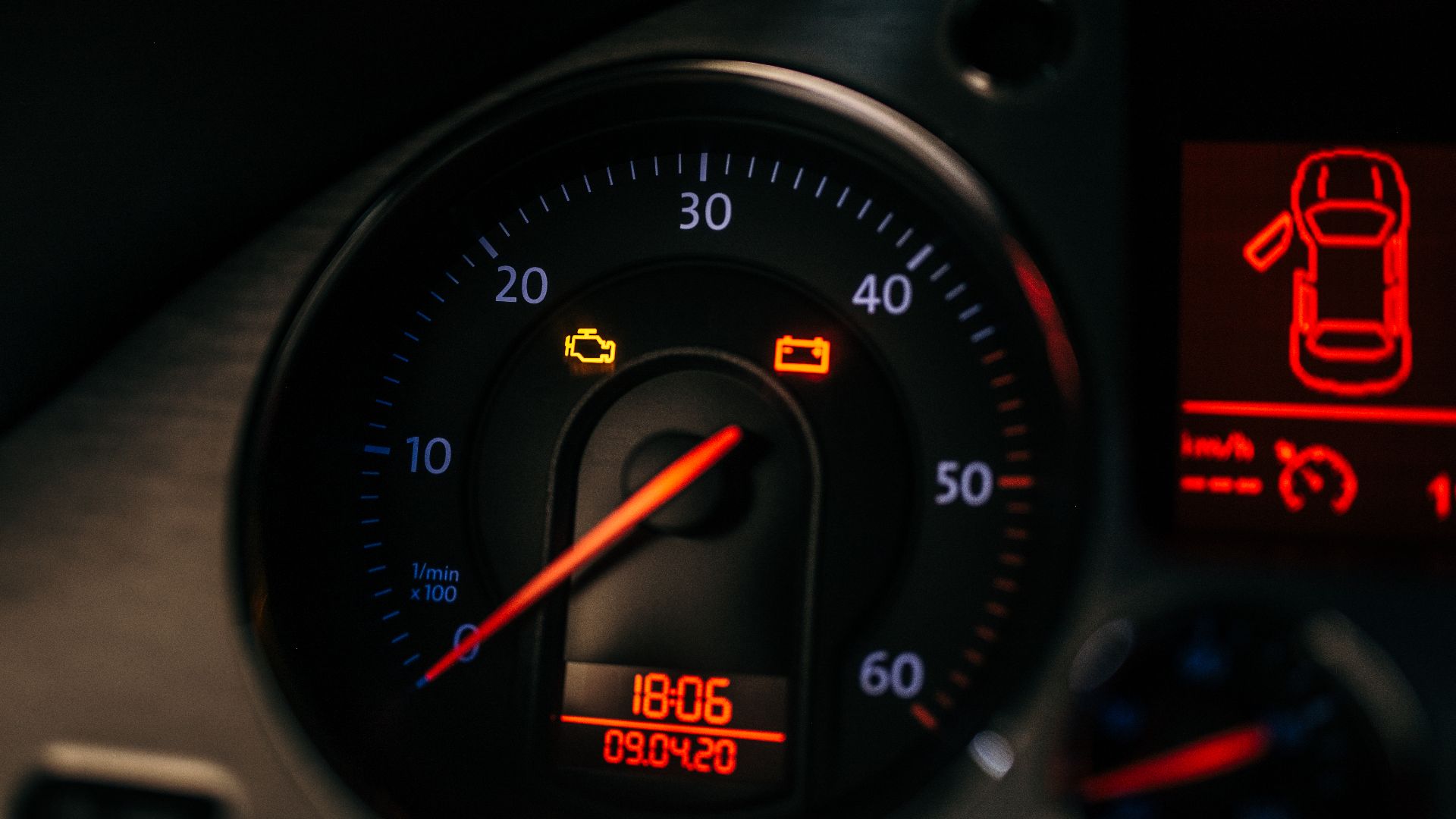 Warning lights on a vehicle's dashboard glow brightly, indicating possible engine problems. The display shows the time as 18:06 on September 4, 2020, creating urgency.