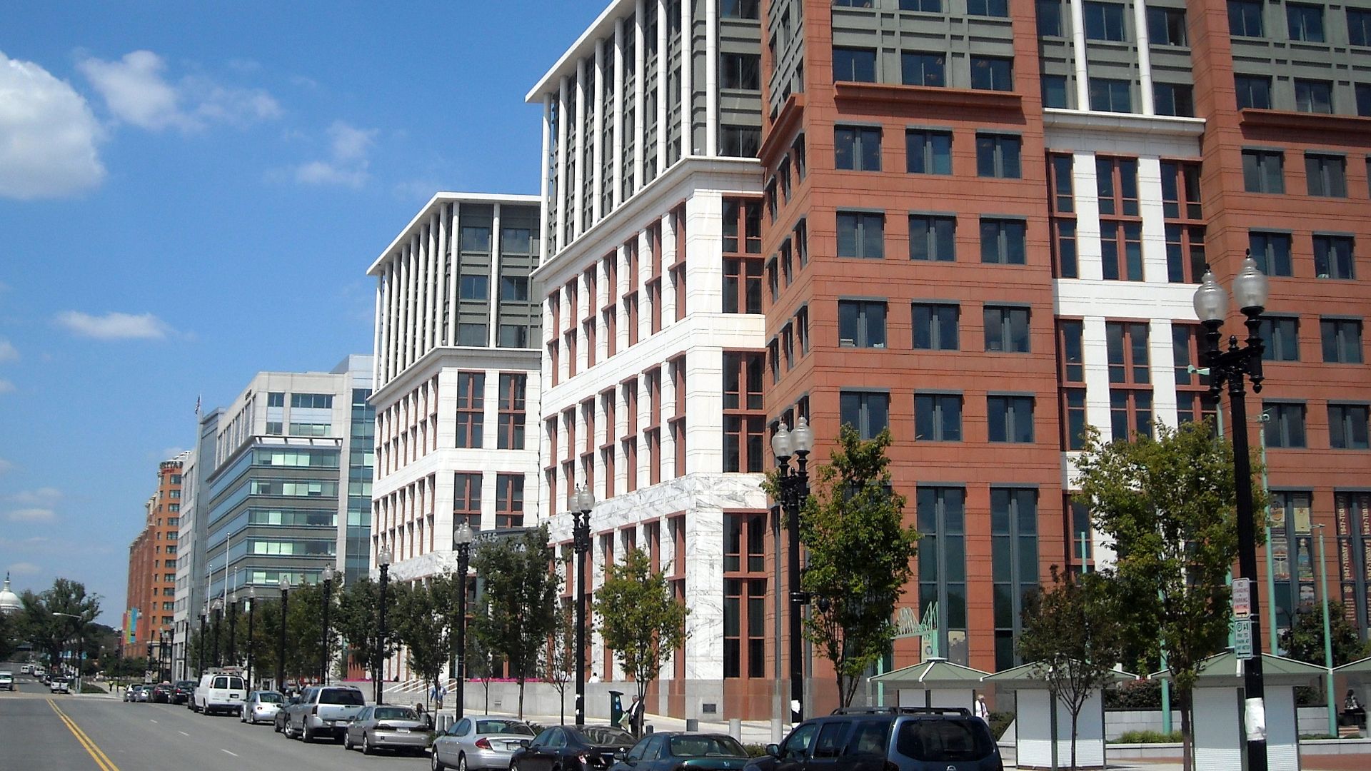 The United States Department of Transportation headquarters, located at 1200 New Jersey Avenue, S.E., in the Navy Yard neighborhood of Washington, D.C.  The dome of the United States Capitol is visible in the background.