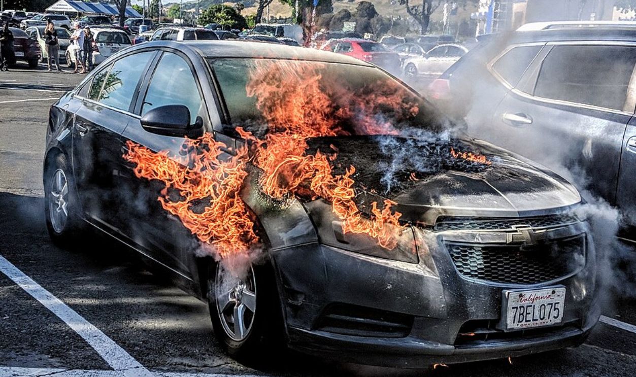 An automobile on fire in a grocery store parking lot in Vallejo, California. Photo by Jim Heaphy.