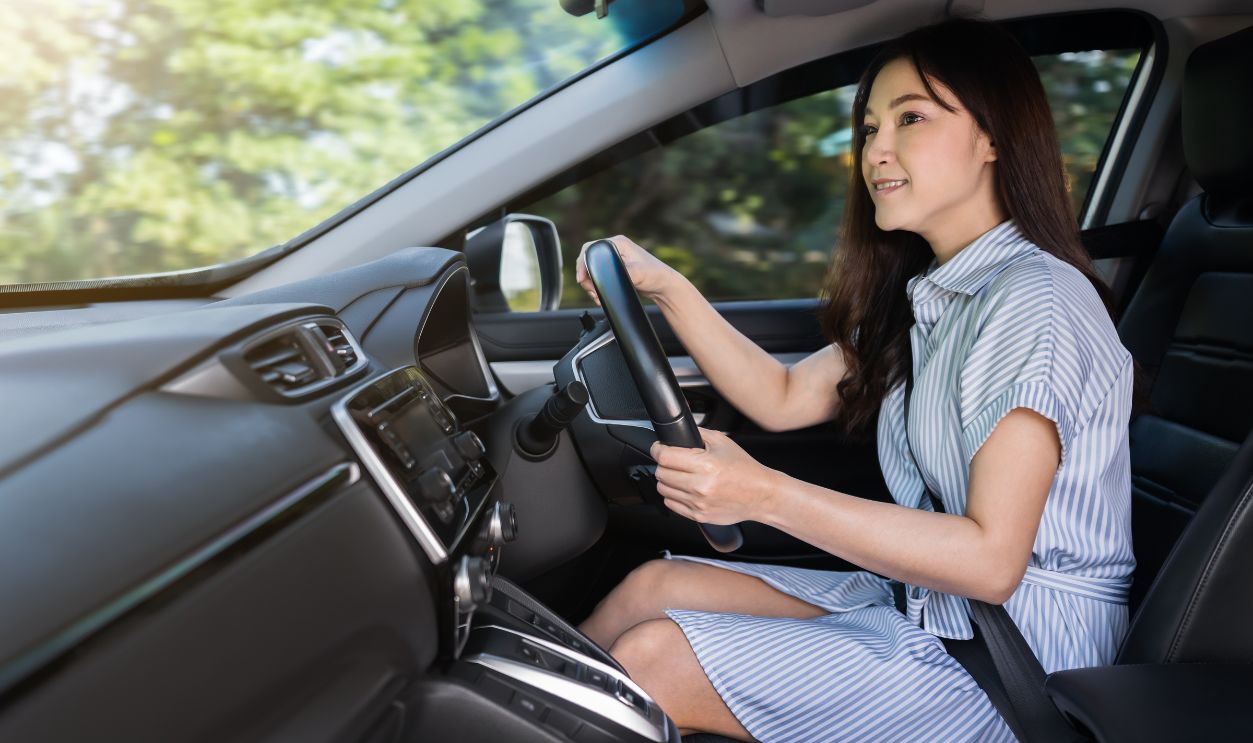 2036662535 - young woman driving a car