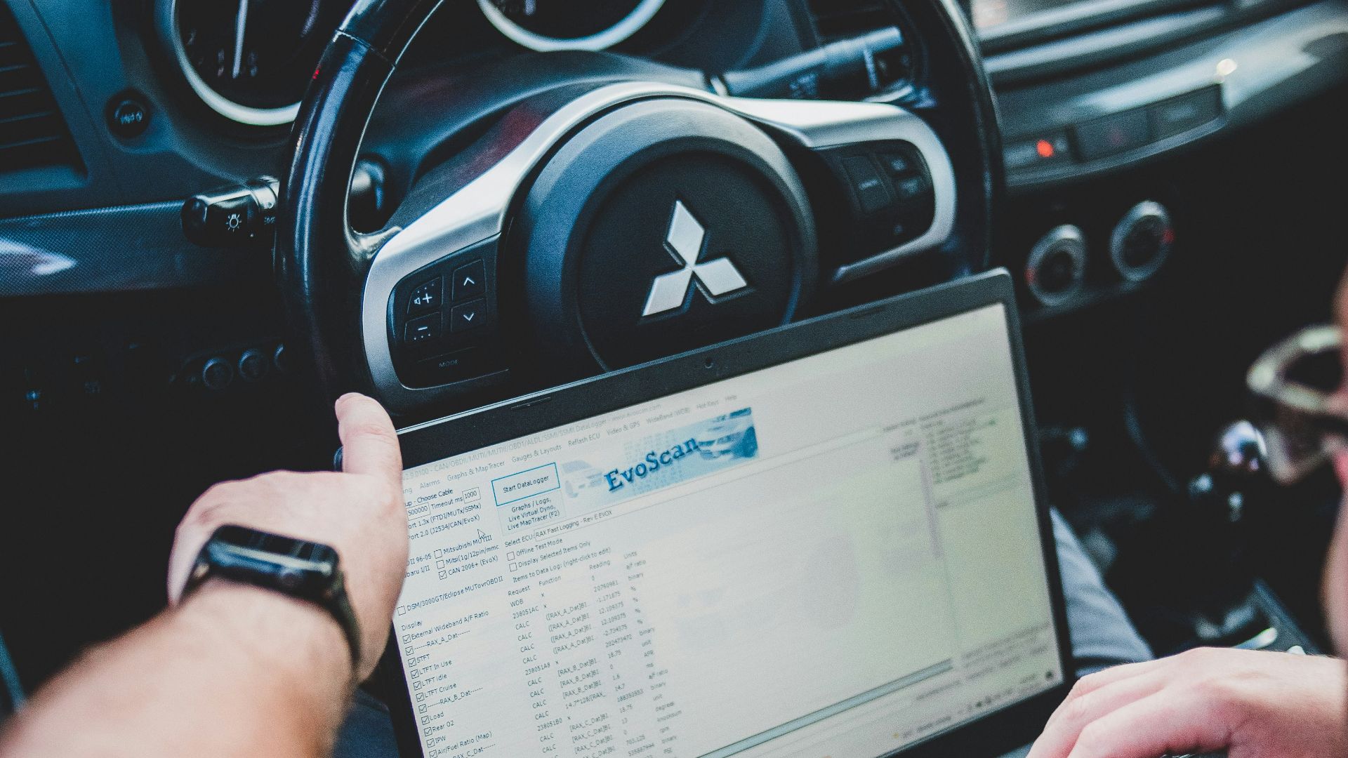 a person holding a laptop