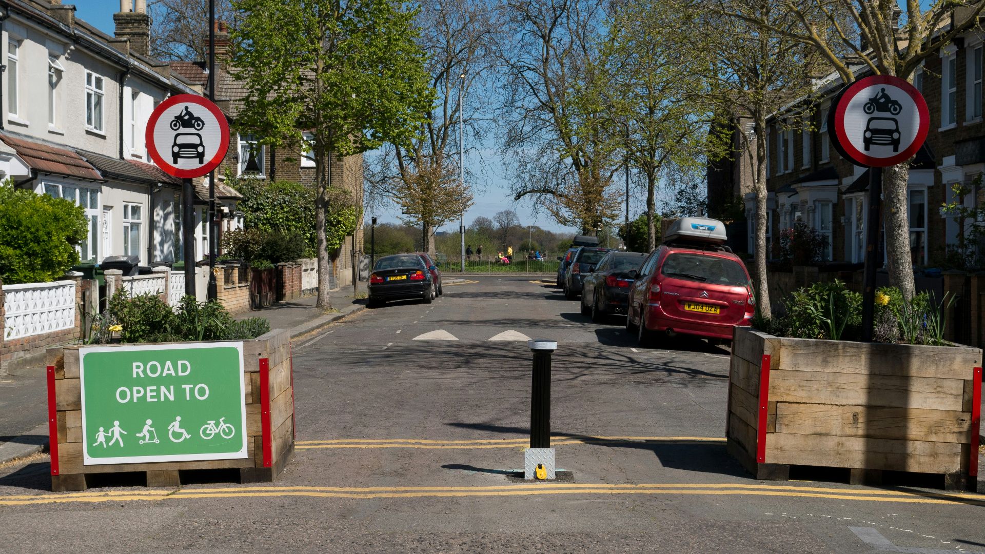 cars parked on side of the road during daytime