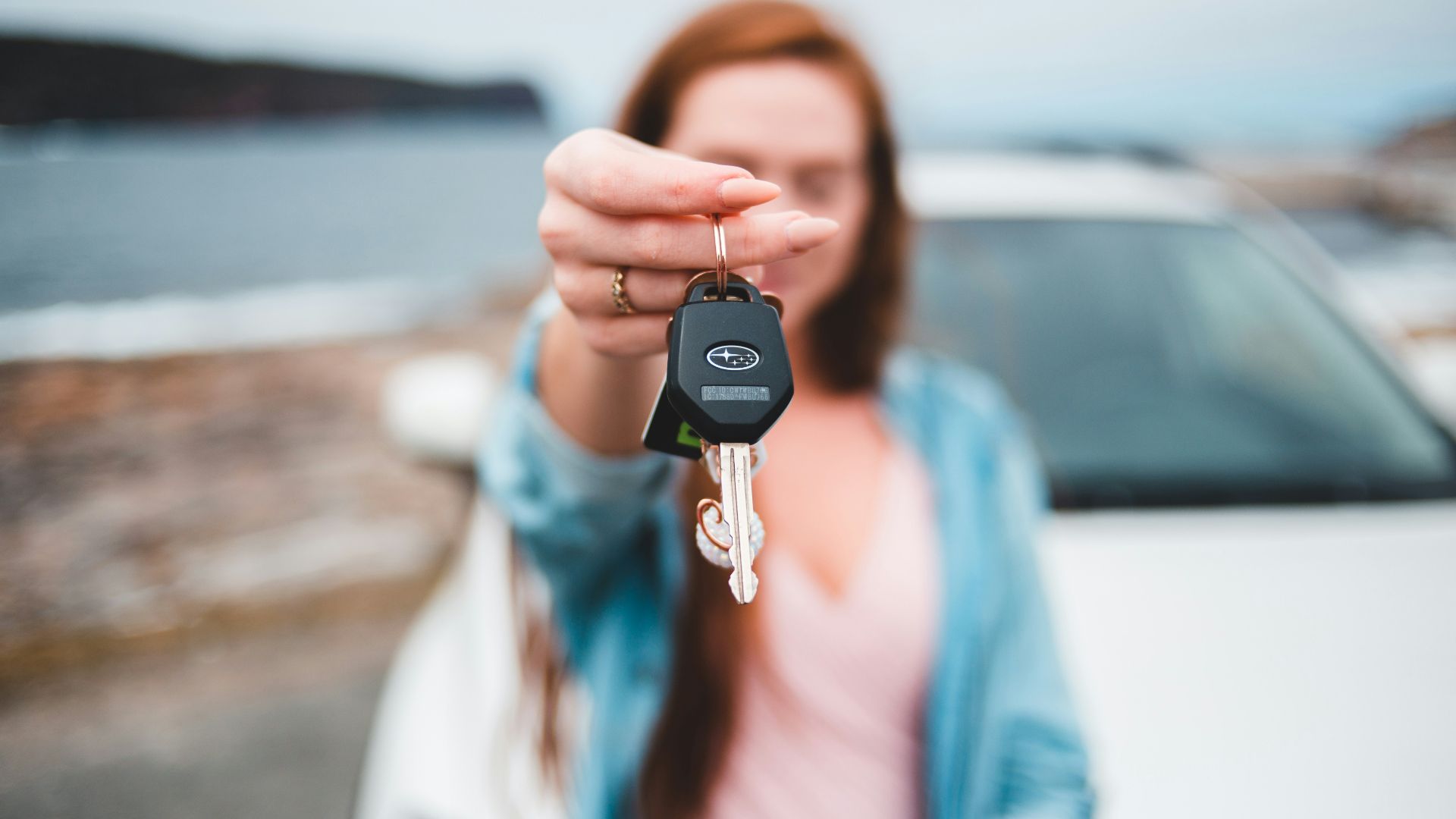focus photography of black vehicle key