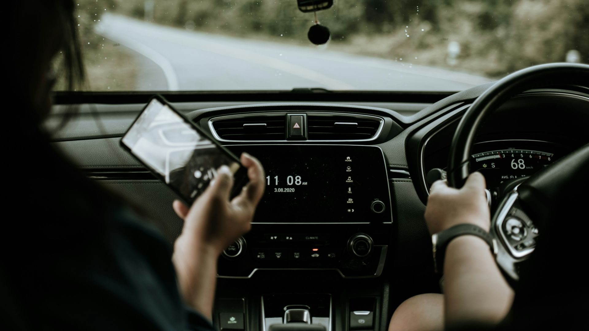person driving car during daytime