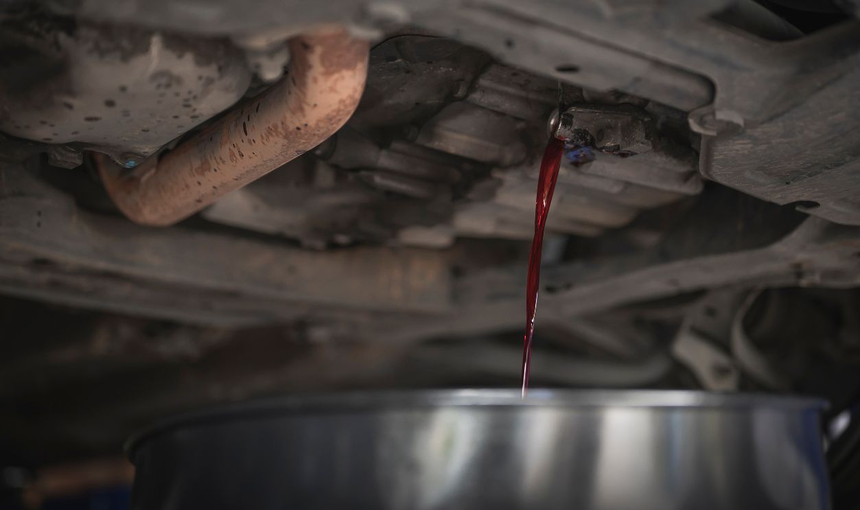 Automatic Transmission fluid drains out of the transmission oil pan.