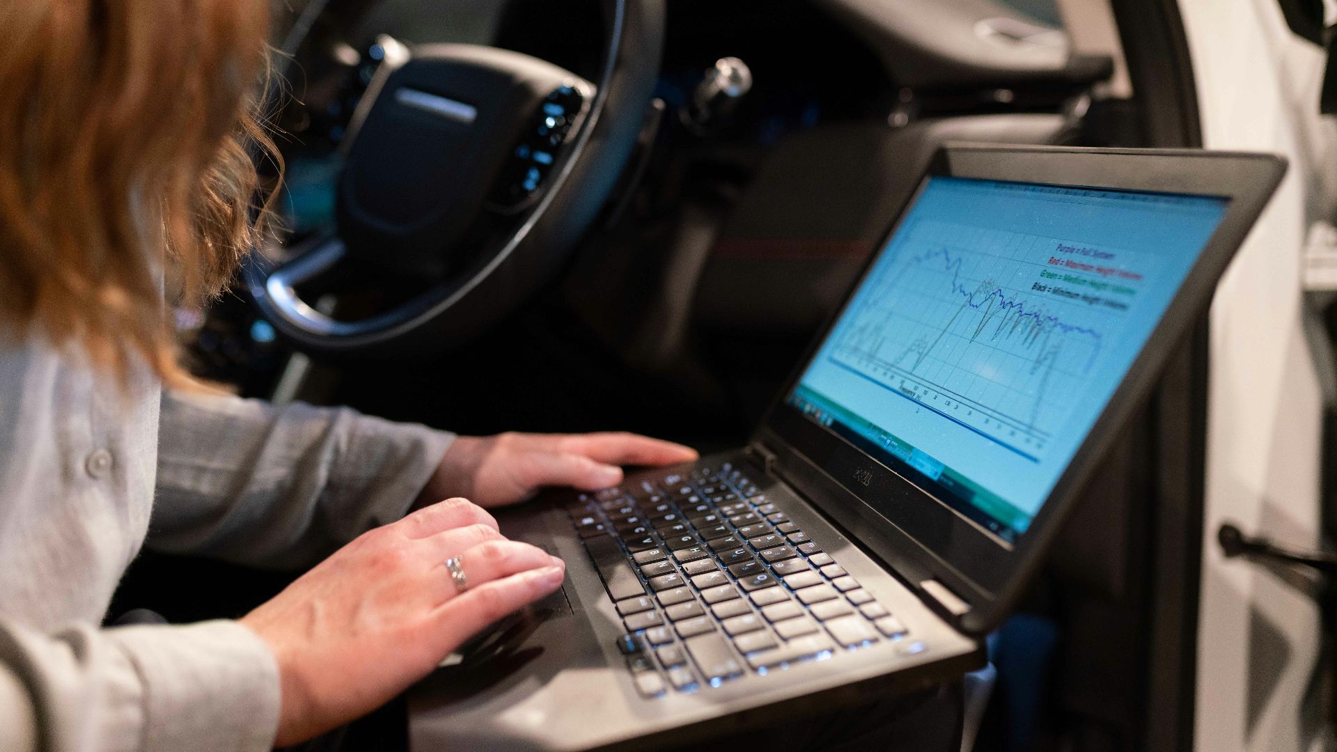 woman in gray long sleeve shirt using black laptop computer