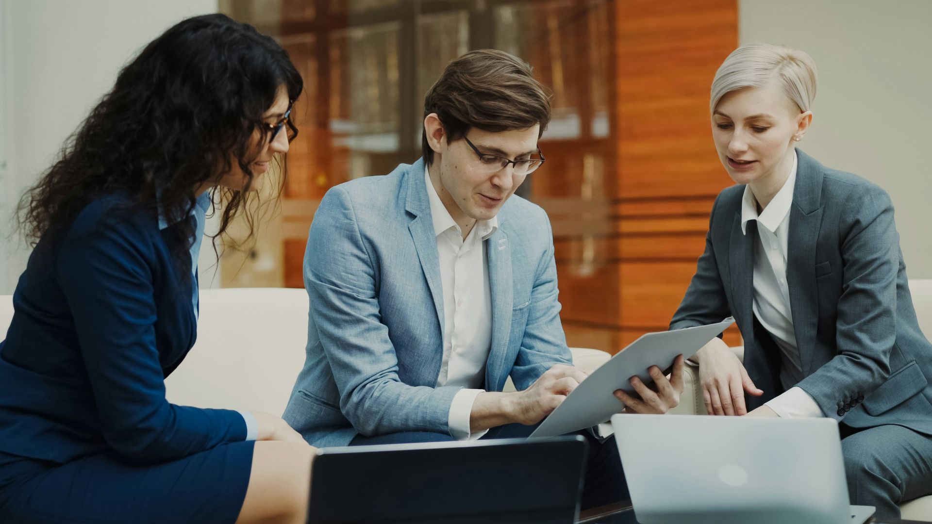 Three business people collaborating on a project