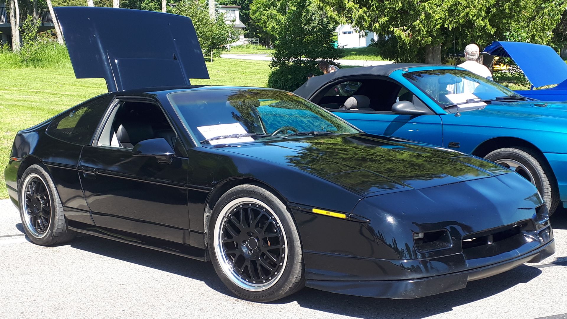 1986 Pontiac Fiero GT photographed in St. Ignace, Michigan at the annual St. Ignace car show weekend.
