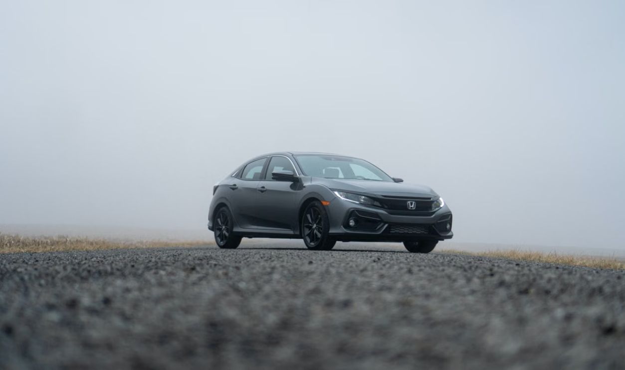 A sleek Honda Civic parked on a foggy day in Fort Wayne, Indiana.