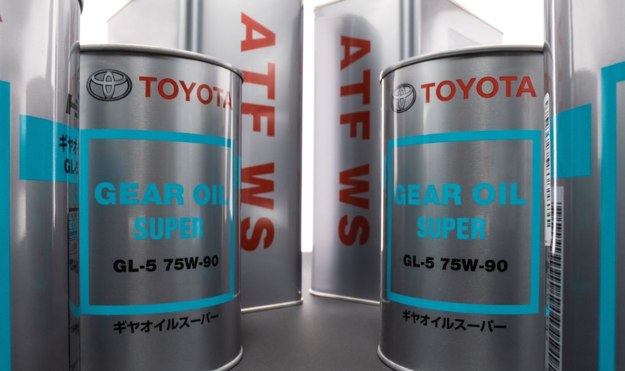 KHARKIV, UKRAINE - DECEMBER 12, 2019: Shooting on wide angle metal cans with transmission synthetic oil Toyota GEAR OIL SUPER 75W-90 GL-5 and ATF WS. Trademark owned by the Toyota Motor Corporation.