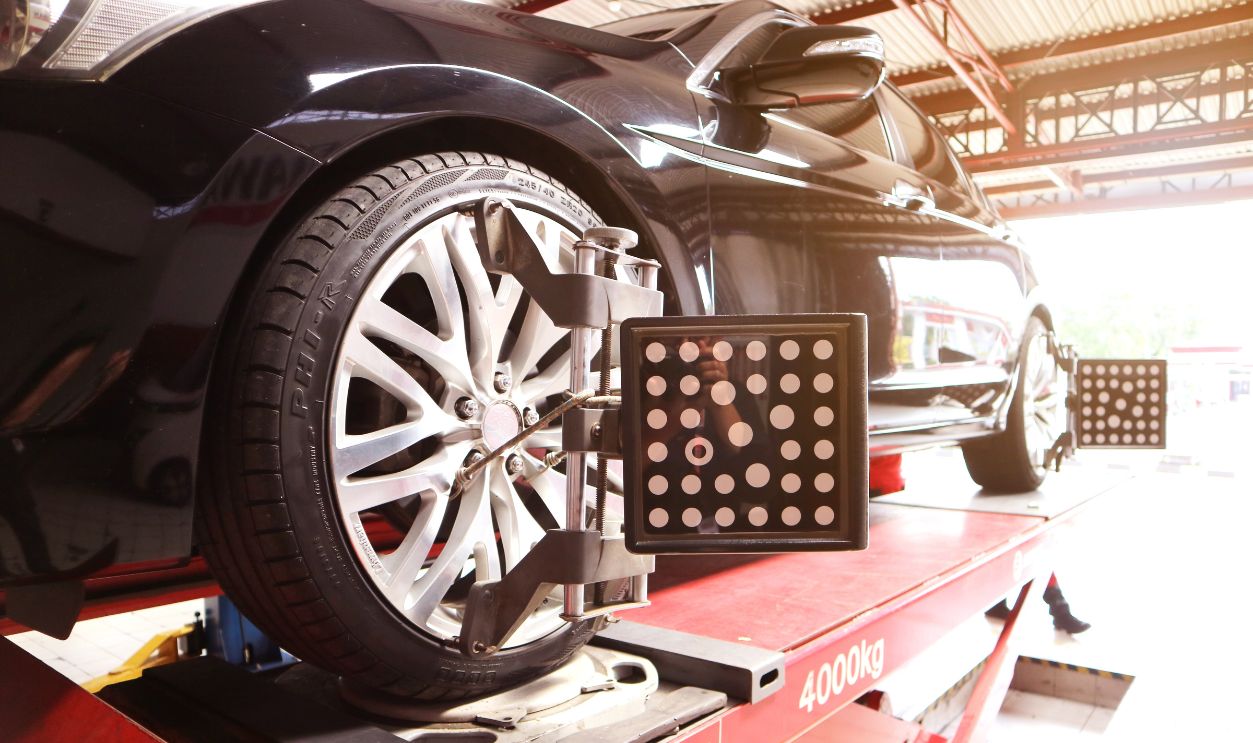 Shutterstock - 2238473027 - Car is doing spooring and balancing work.