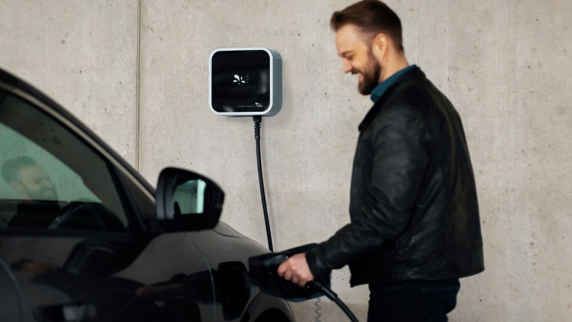A man is pumping gas into his car