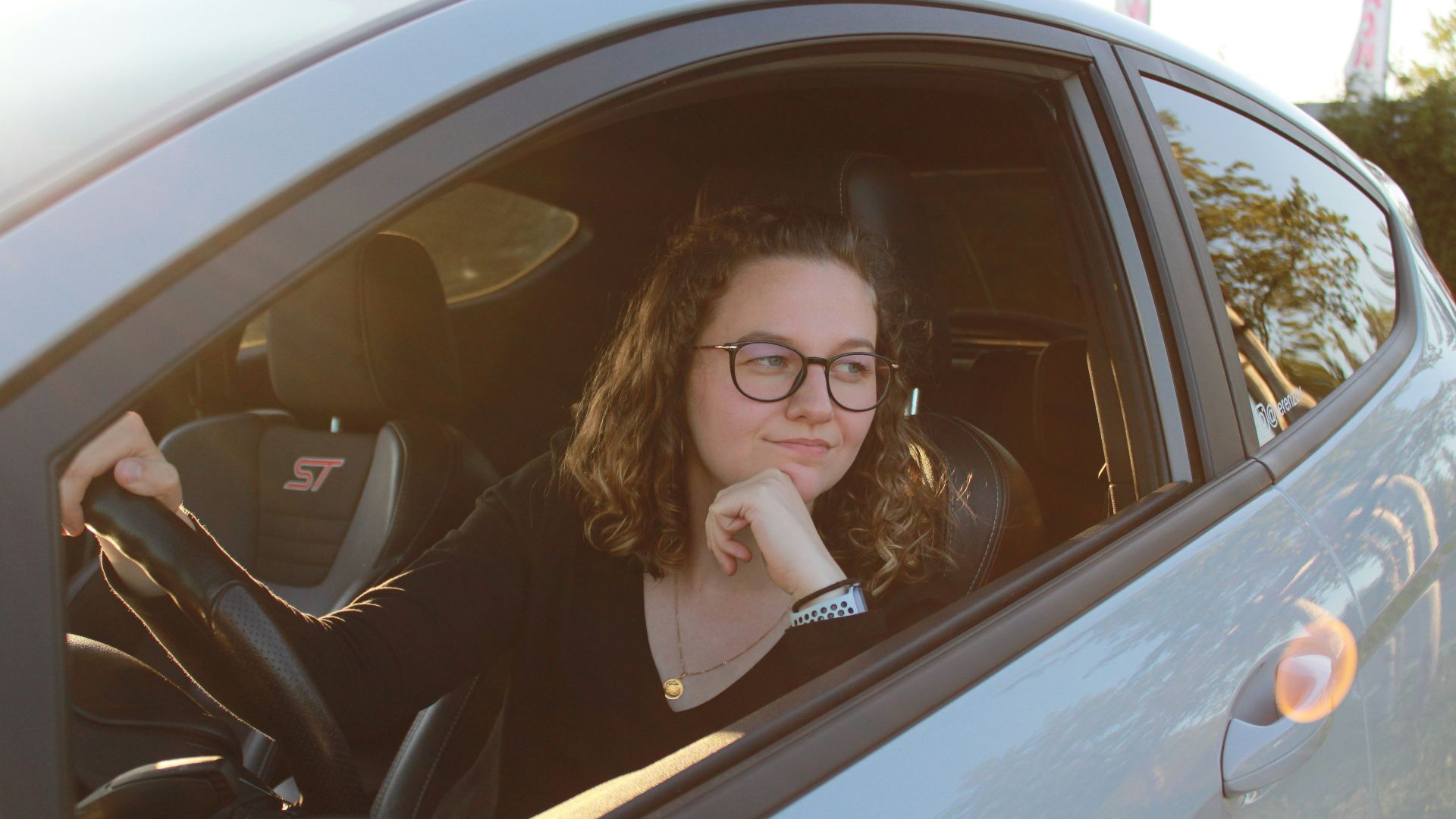 a woman sitting in a car