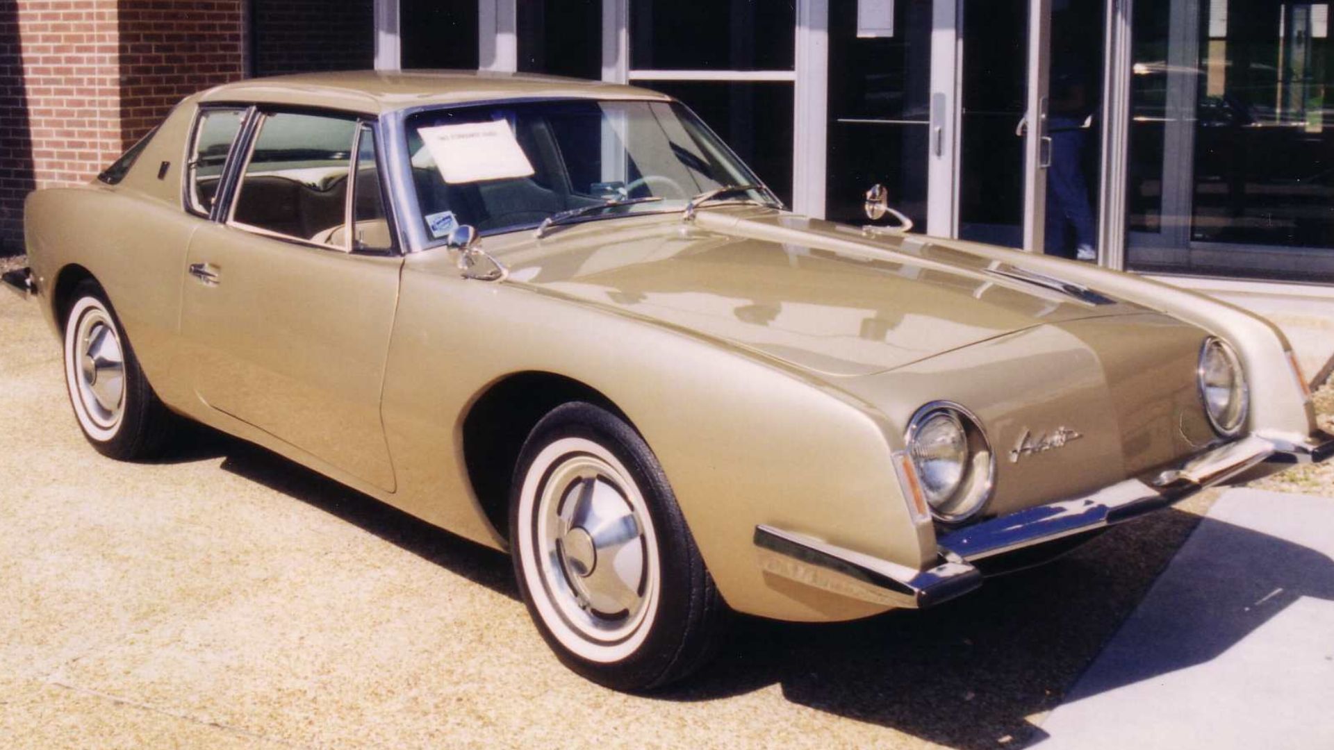 1963 Studebaker Avanti coupe - finished in gold. Picture taken on the campus of Concord University in Athens, West Virginia.
