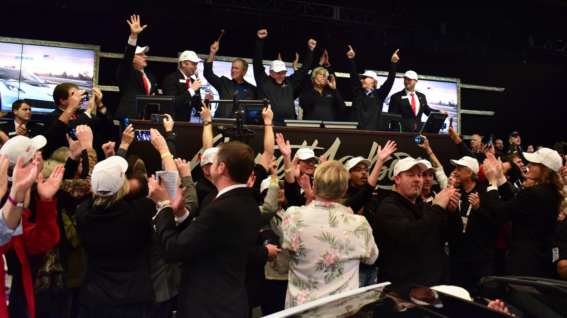 Former U.S. President George W. Bush on the auction block for the sale of the first production 2018 Corvette Carbon 65 to benefit the former president's Military Service Initiative.