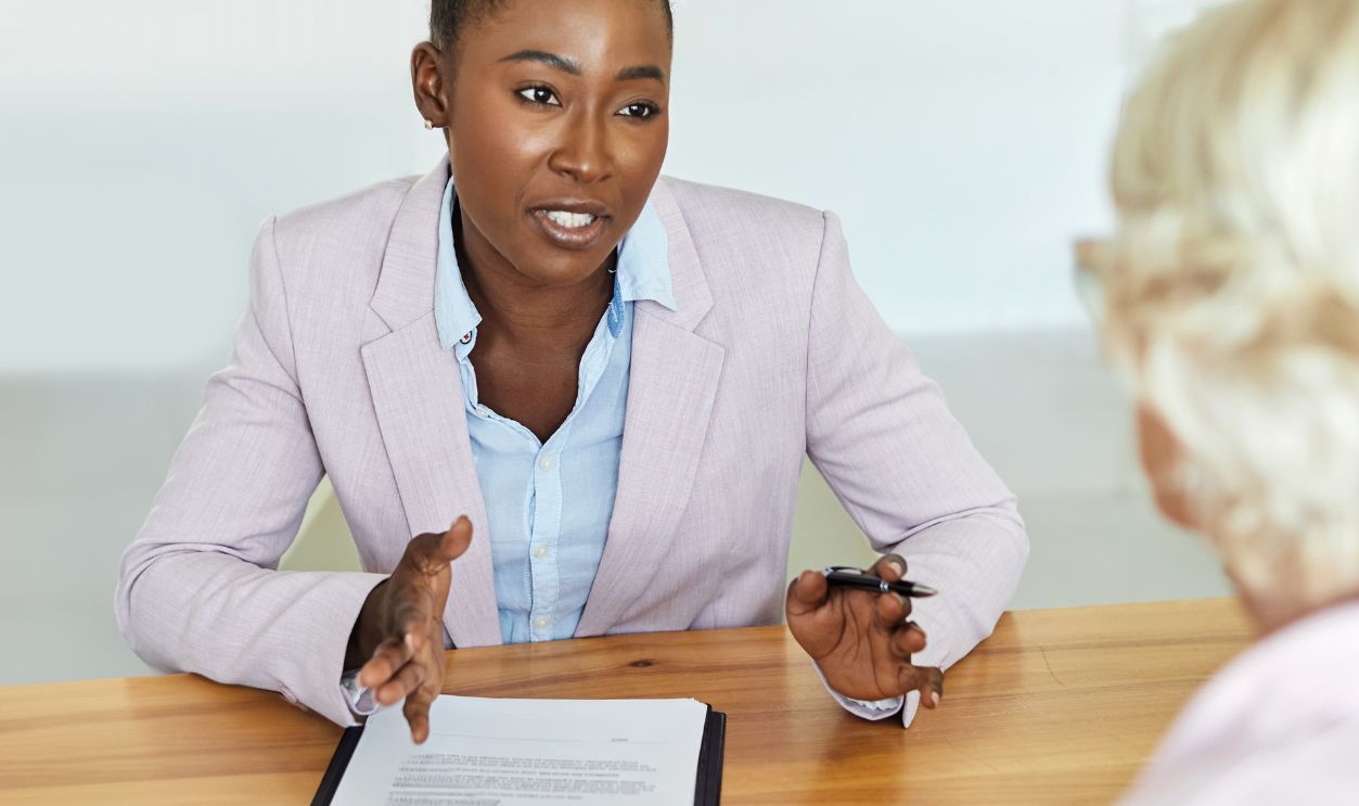 Shutterstock-2658407387, Happy senior old family couple clients make financial insurance estate business deal contract signing, agent lawyer, satisfied mature customers signing contract meeting bank manager agree on investment
