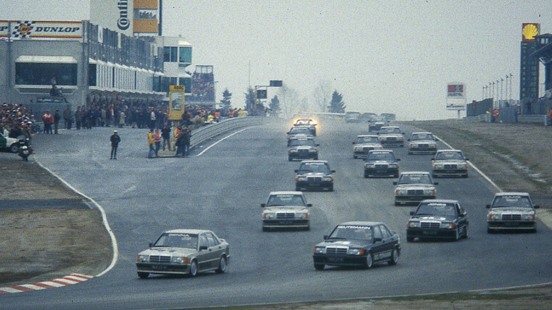 The inaugural race of Nürburgring's new Grand Prix track on 12 May 1984 was an exhibition involving Formula 1 drivers, including retired drivers such as Stirling Moss and World Champions including Jack Brabham. They all drove identical Mercedes-Benz 190E