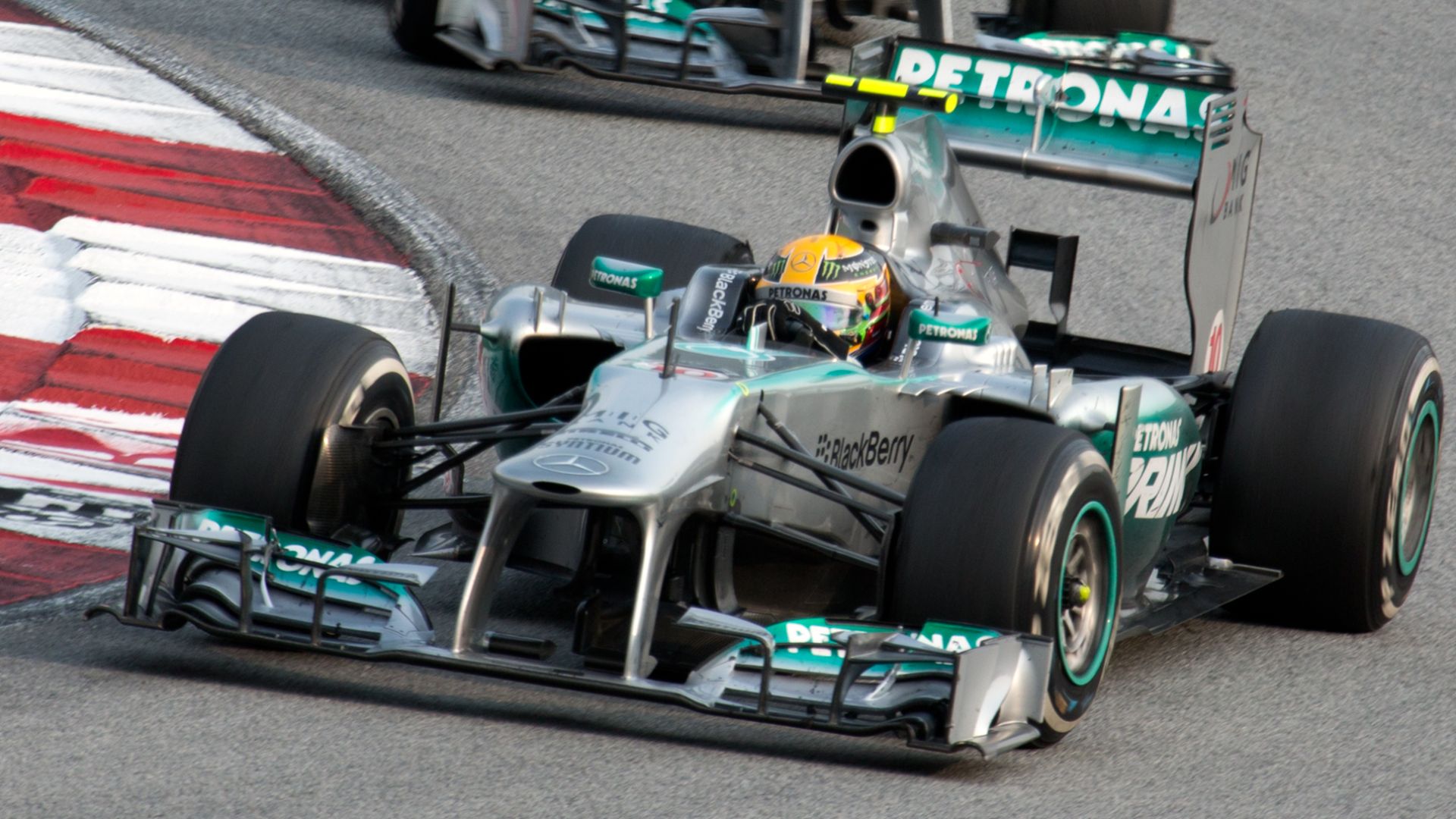 Formula One 2013 Rd.2 Malaysian GP: Lewis Hamilton (Mercedes) and Nico Rosberg (Mercedes). Rosberg does not try to overtake Hamilton.