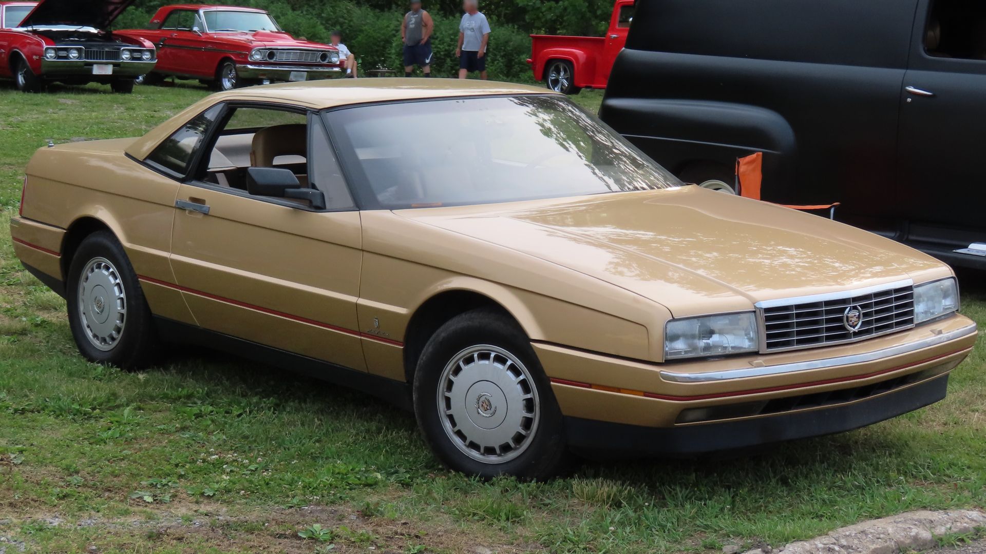 1987 Cadillac Allanté photographed at the June 19th, 2023 Cruisin' the River Lowellville Car Show in Lowellville, Ohio. Finished in Gold Metallic (1 of 426 in this color).