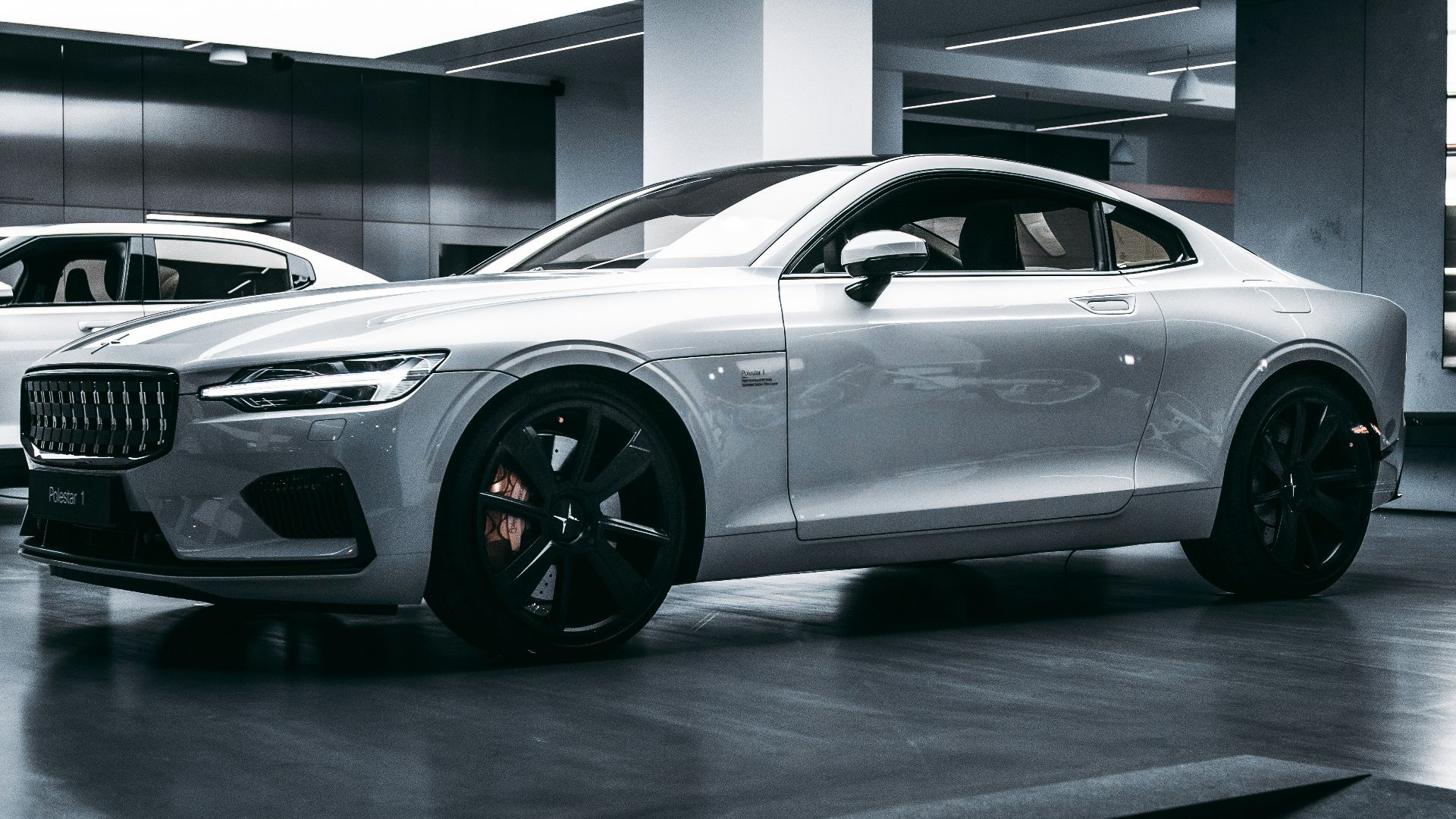 silver bmw m 3 coupe parked in building