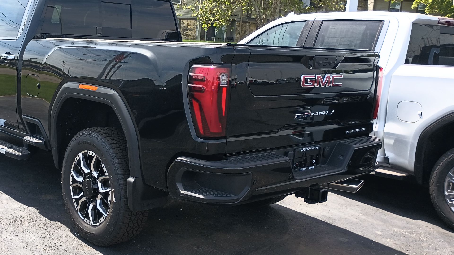 Rear view of a 2024 GMC Sierra 2500HD Denali Crew Cab heavy duty pickup truck.