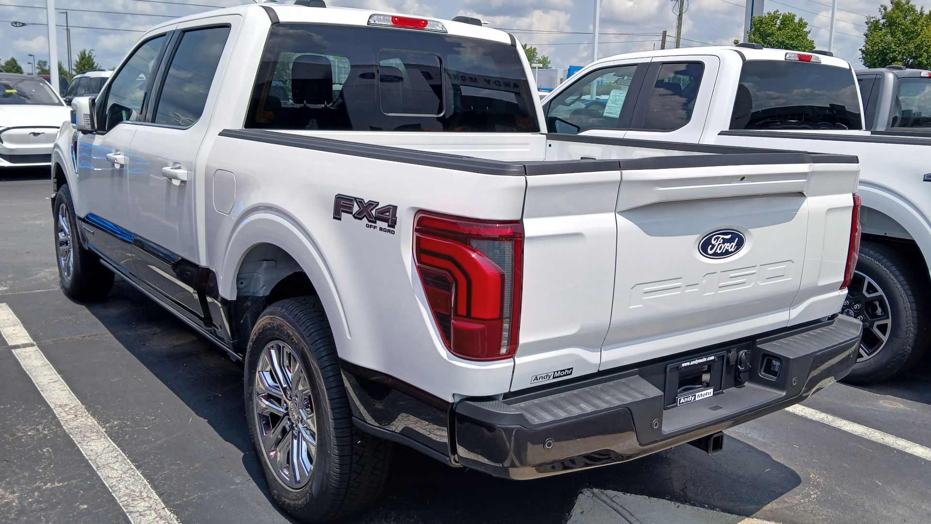 Rear view of a 2024 Ford F-150 King Ranch SuperCrew PowerBoost pickup truck.