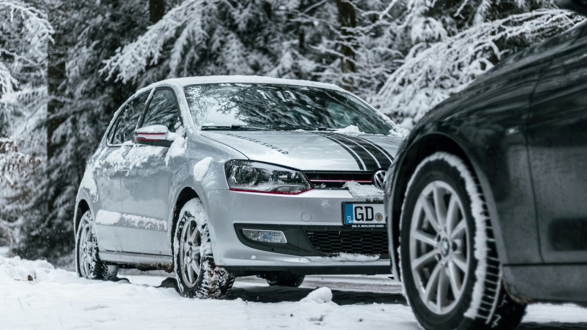 gray bmw m 3 on snow covered ground