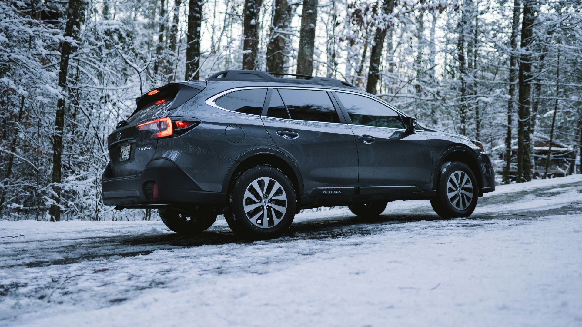 black suv on snow covered ground