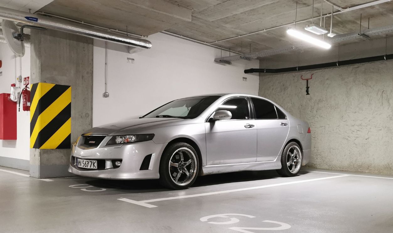 Silver Honda Accord parked in a clean, well-lit indoor garage space