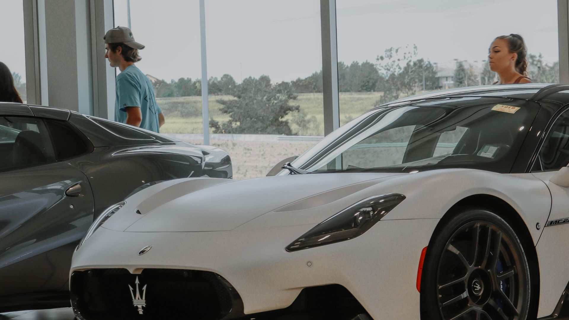Elegantly displayed Maserati vehicles in a modern car showroom, capturing luxury and style.