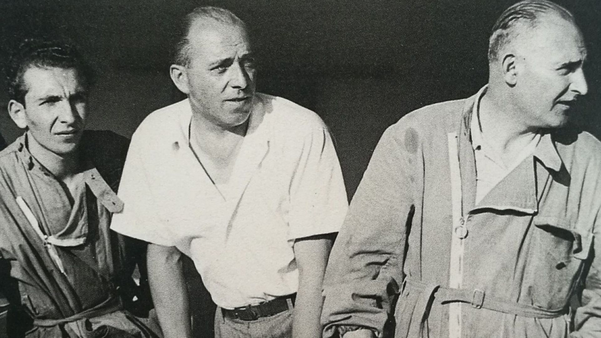 Ferrari engineers with 12 spark plugs in 1949.  From left: Cassani (Pasquale?), Gioacchino Colombo and Luigi Bazzi. Source says this is at European GP, so it should be same as Italian GP at Monza on 11 September 1949 won by Alberto Ascari in a Ferrari 125