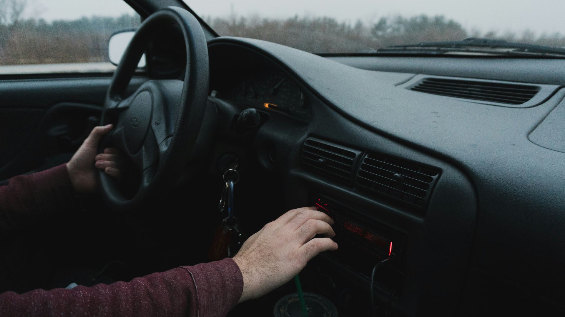 person driving black car