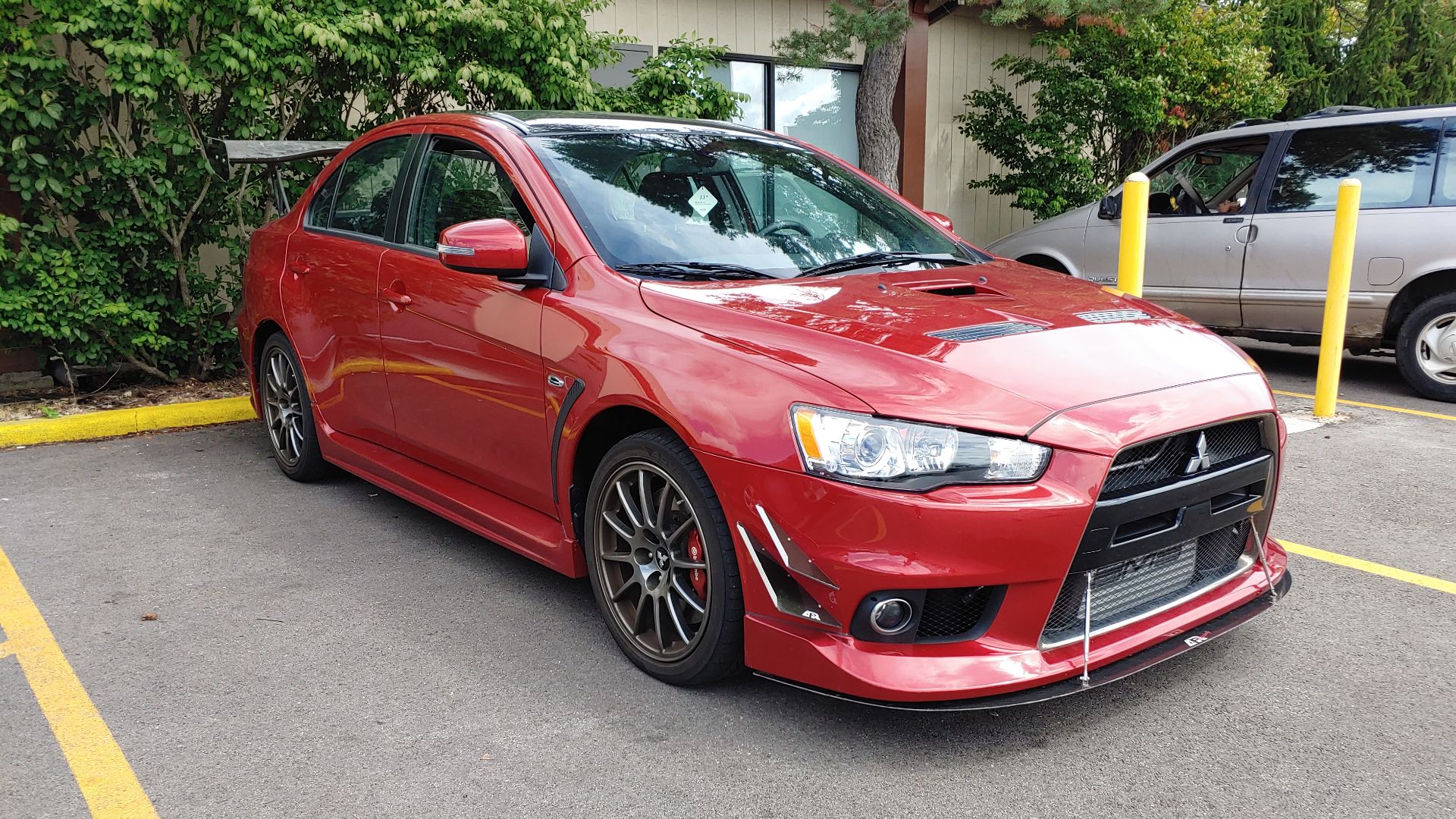 Left view of a Mitsubishi Lancer Evolution X Final Edition, with APR Performance aftermarket parts