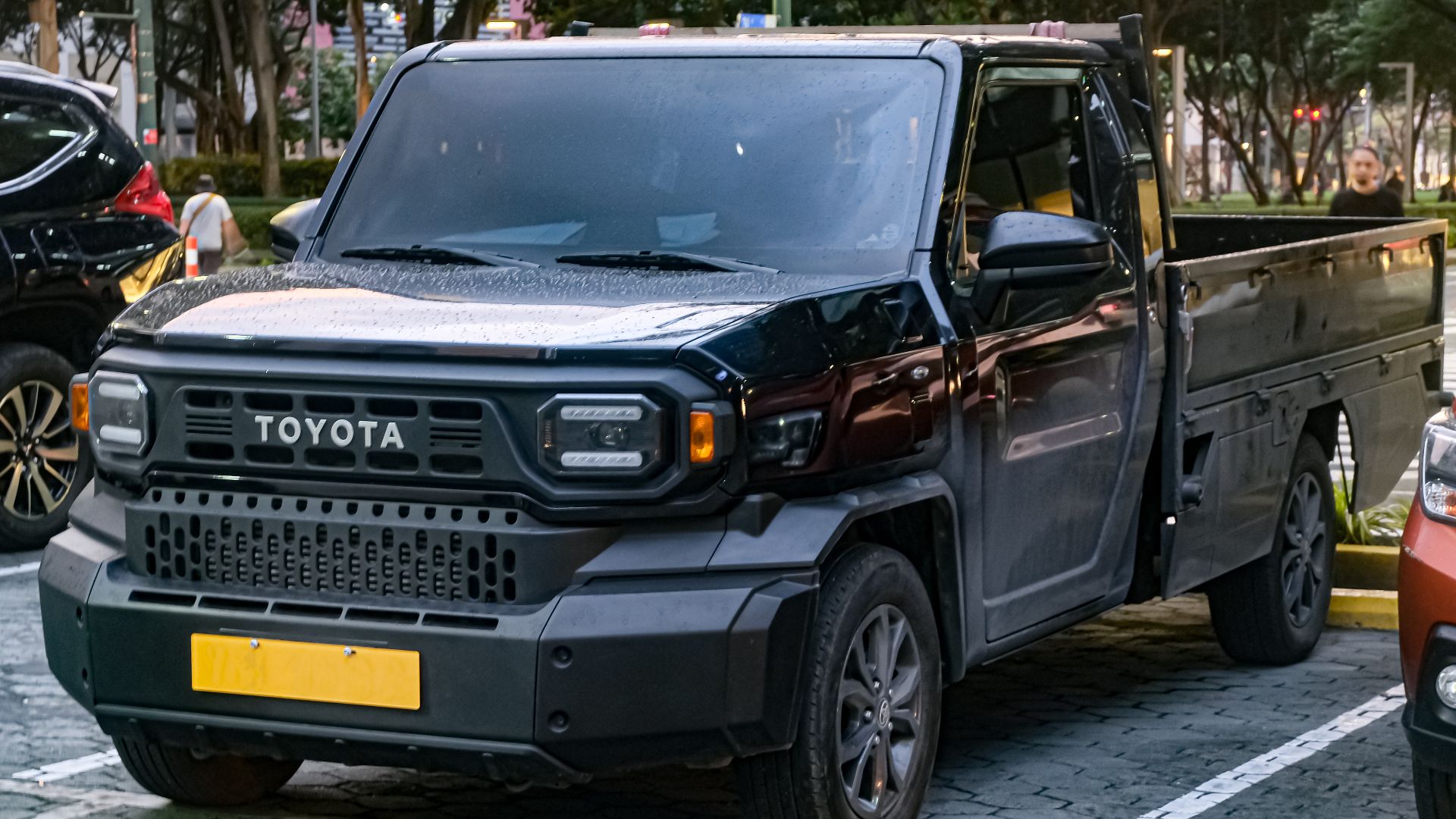 Black Toyota Tamaraw GUN122 2.4 GL Dropside. Exclusive to this model is a 6-speed automatic, 16-inch alloys, LED headlamps and DRLs, among others.