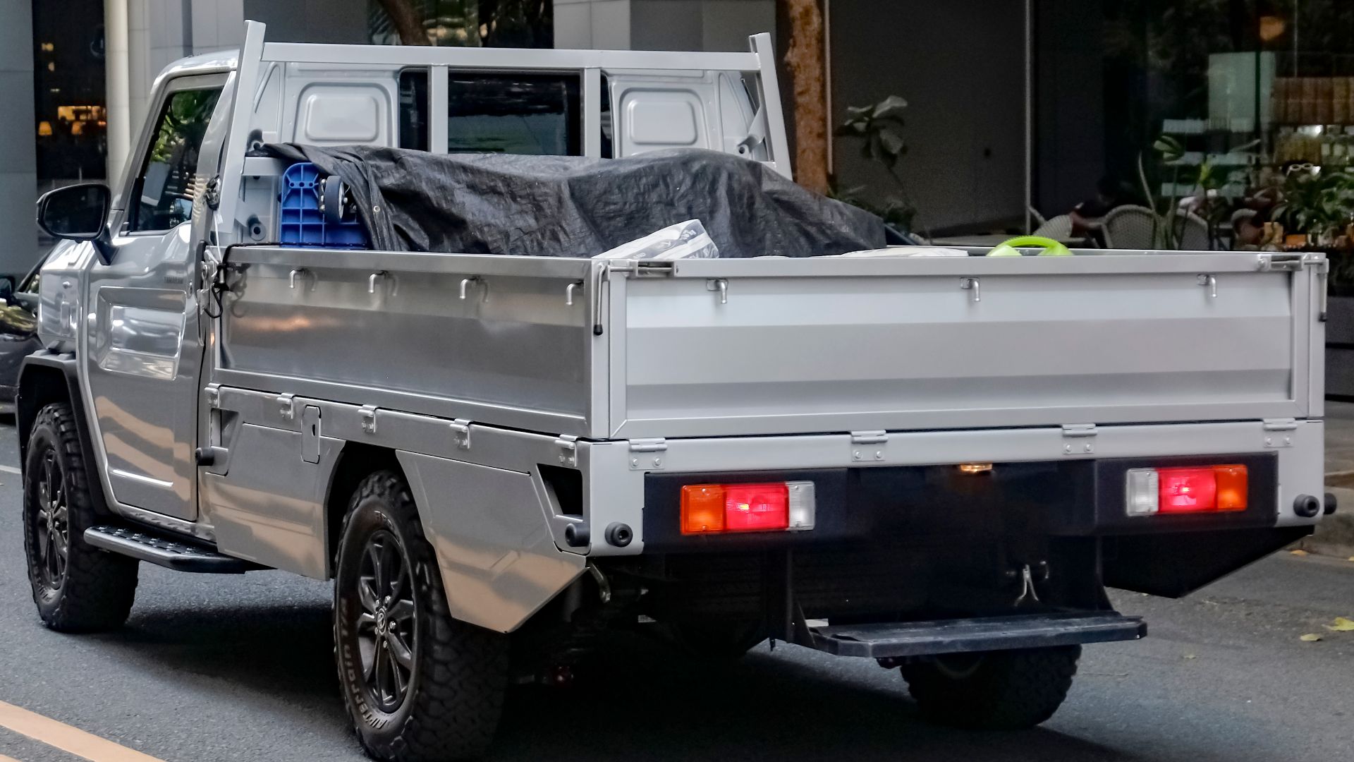 Silver Metallic Toyota Tamaraw GUN122 2.4 GL Dropside pickup truck. Original image had plates; photoshopped it up as it was easy to on the plastic bumpers, so it did have plates before.