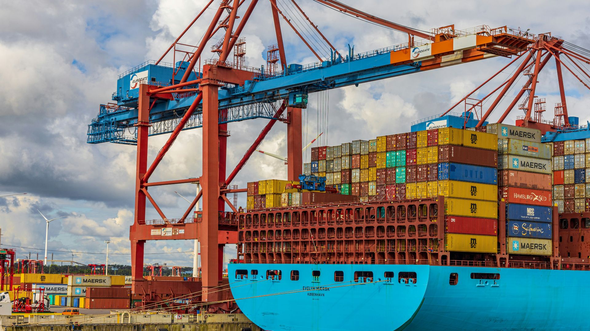 blue and red cargo ship