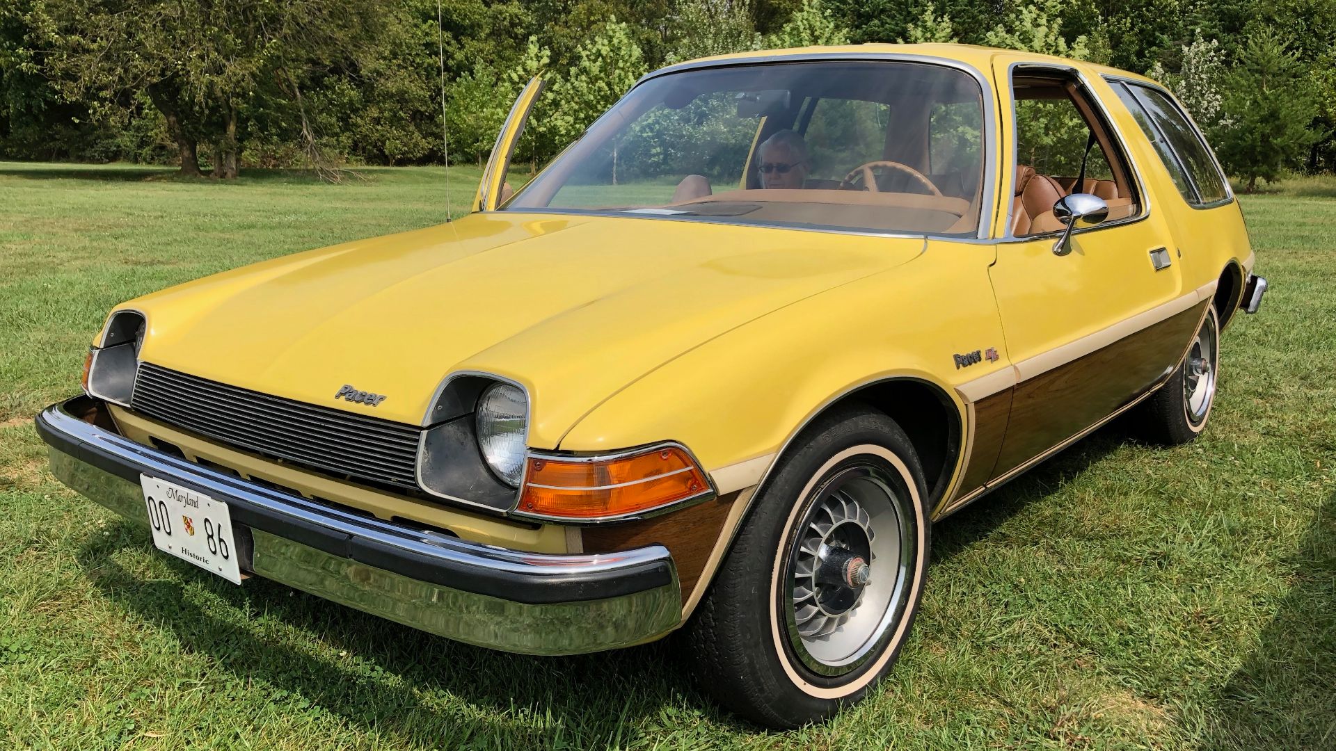 Front left side view of a 1977 AMC Pacer DL two-door station wagon. First model year of the station wagon body style for the Pacer. Built by American Motors Corporation (AMC) in Kenosha, Wisconsin. This Pacer is in original factory condition and finished