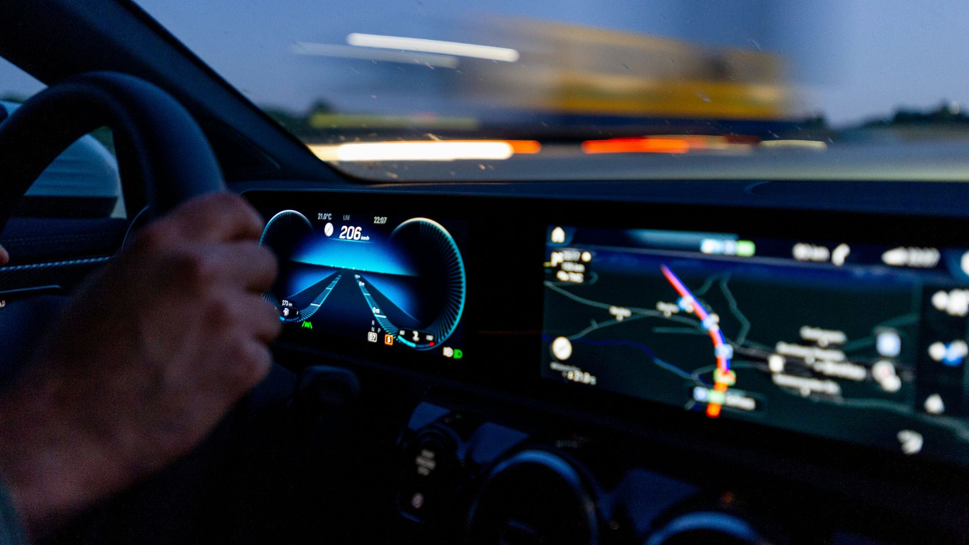 person's hand on steering wheel