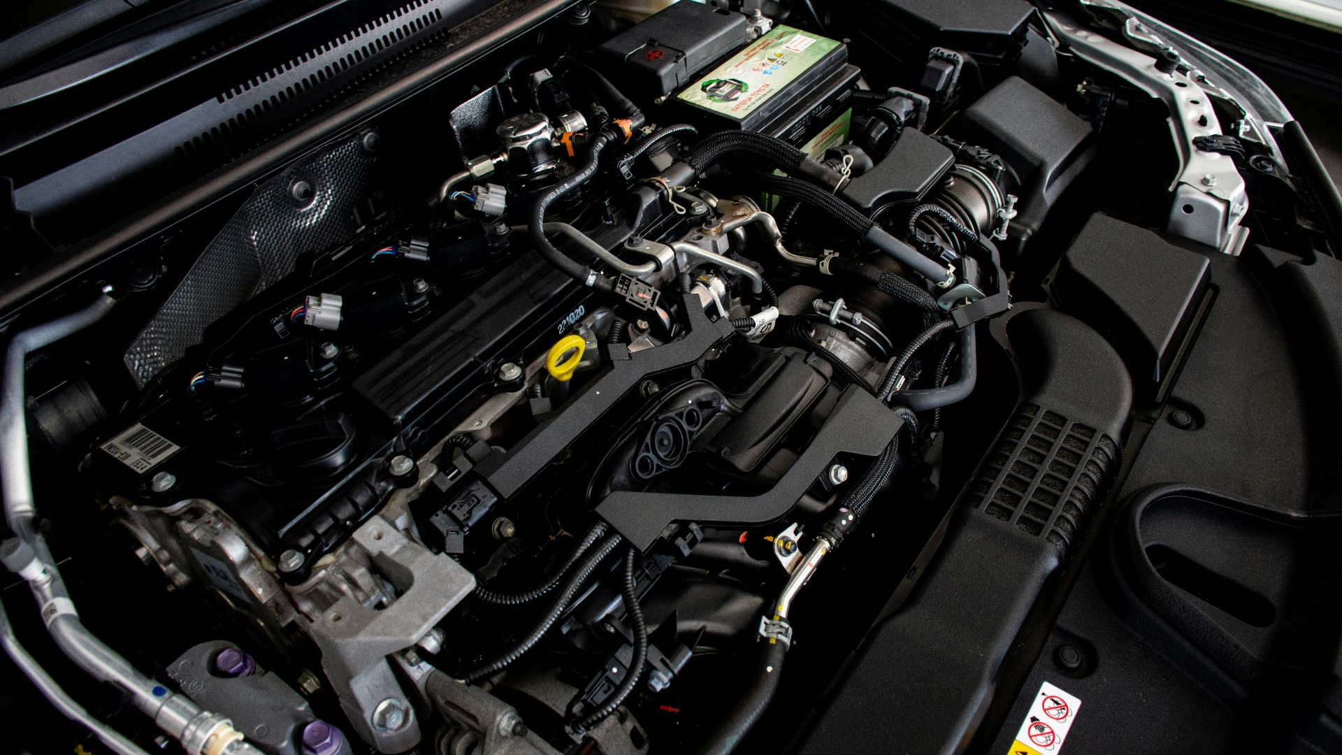 the engine compartment of a car with its hood open