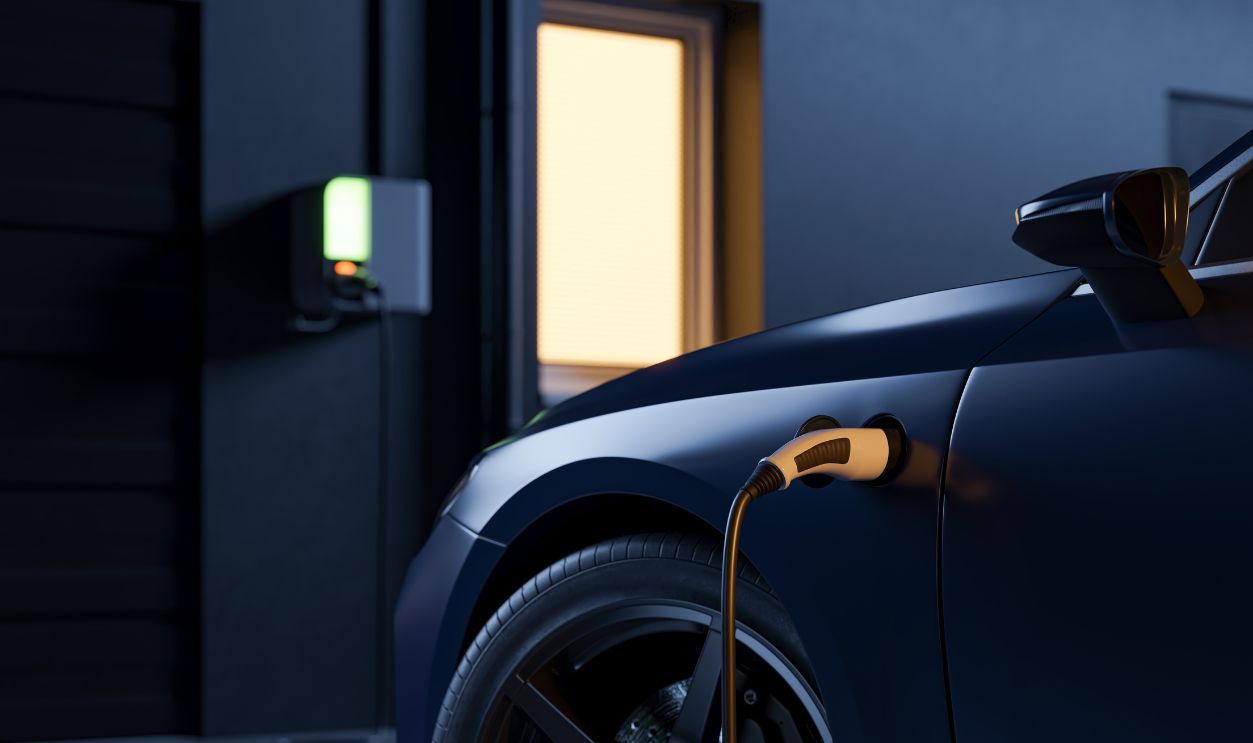 EV charging connector plugged into electric car at night, home charging station with glowing indicator. 3d illustration