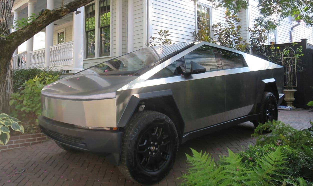 Charlotte NC, USA, 08.25.2024 - Tesla Cybertruck parked near house. 