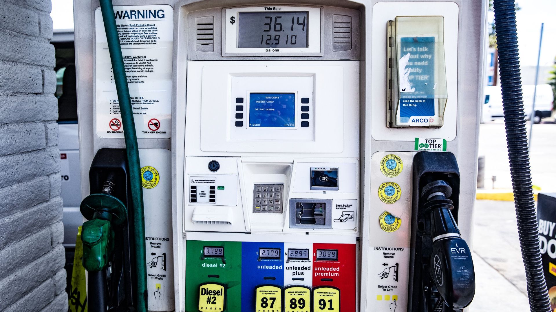 Close-up of a fuel pump showing gasoline and diesel options at a gas station in Los Angeles.