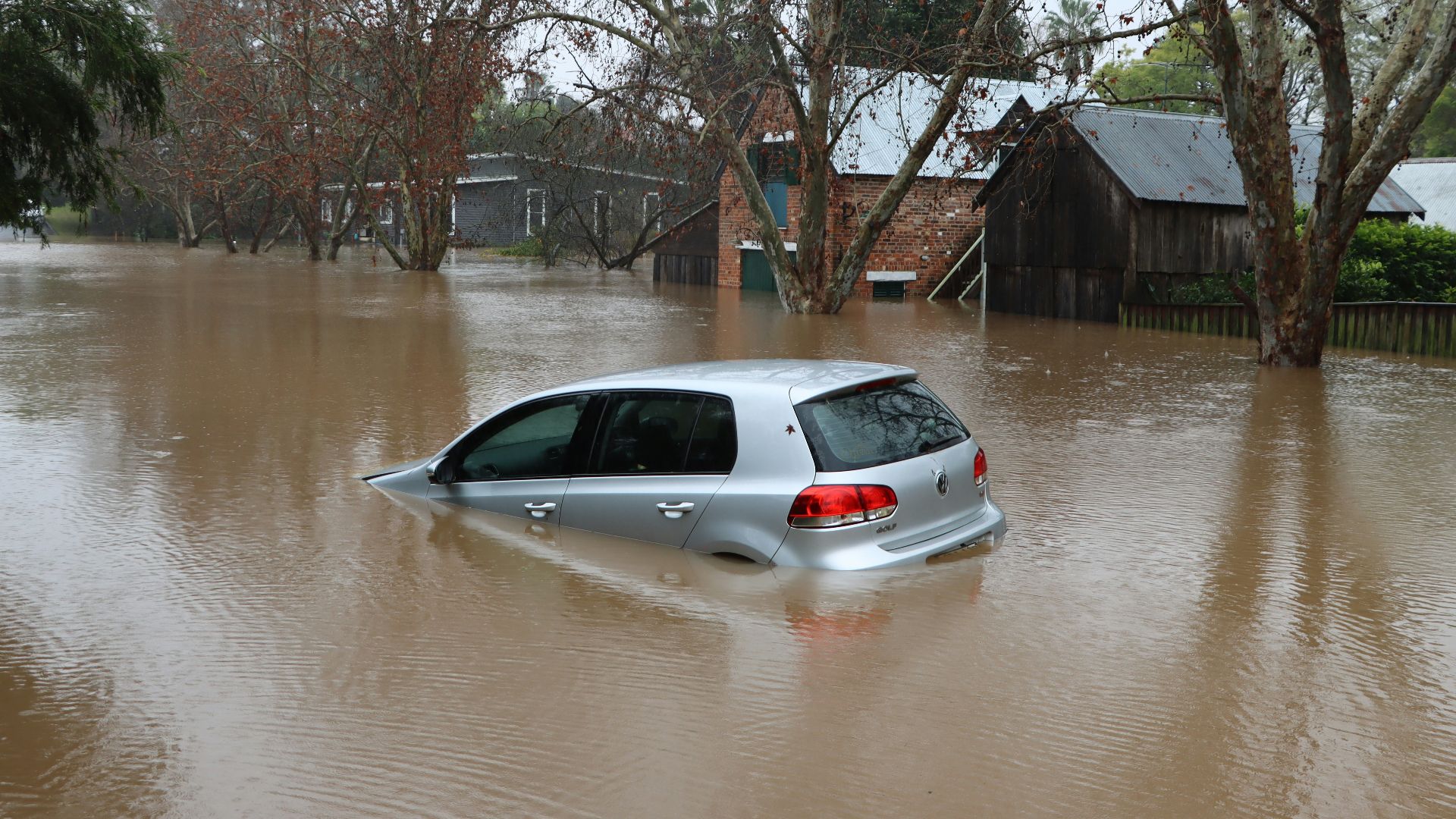 a car driving through a flooded street