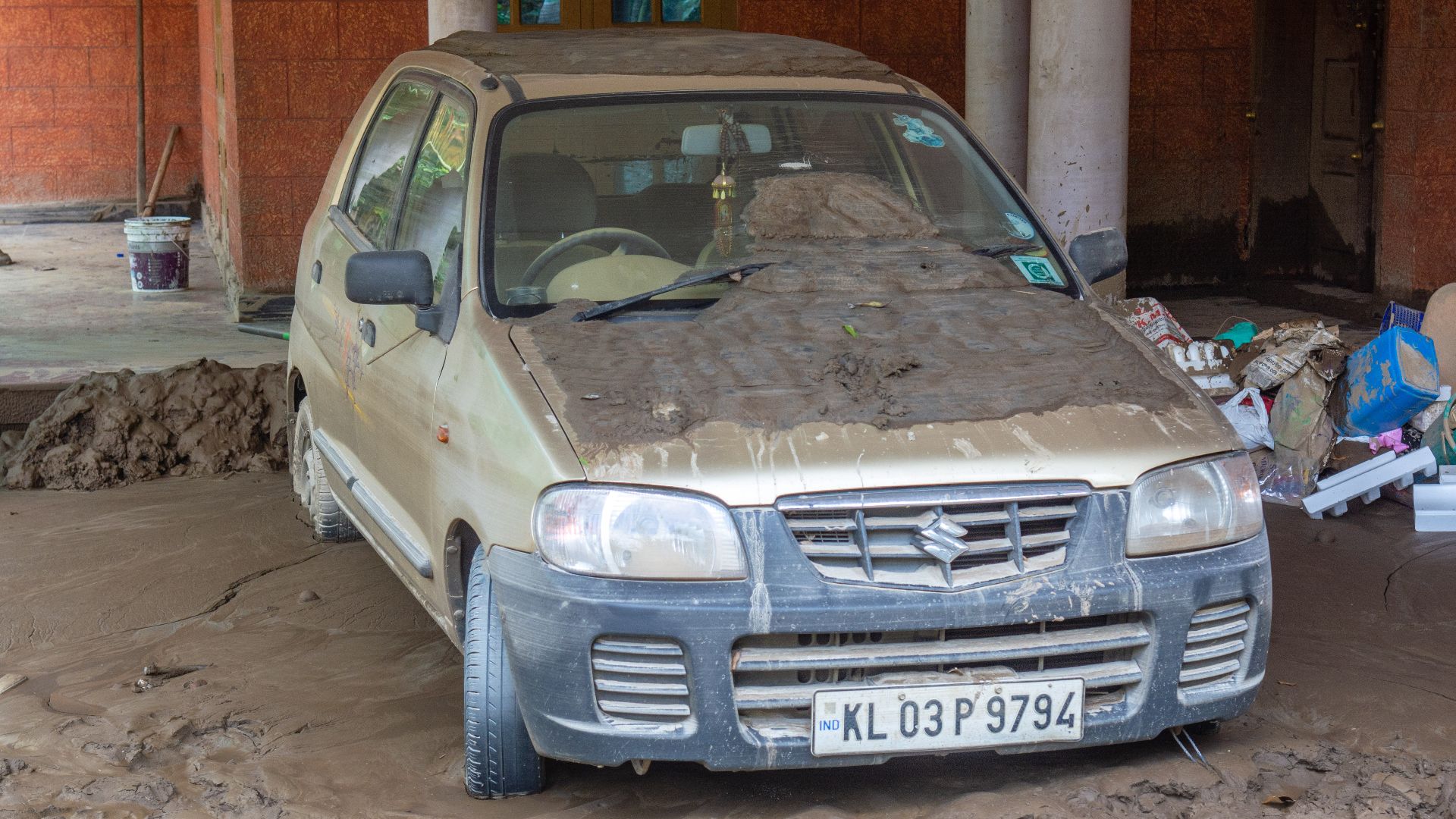 car covered in mud as kerala was flooded