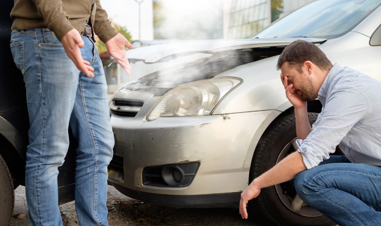 Shutterstock - 508561612 - Two men arguing after a car accident on the road.